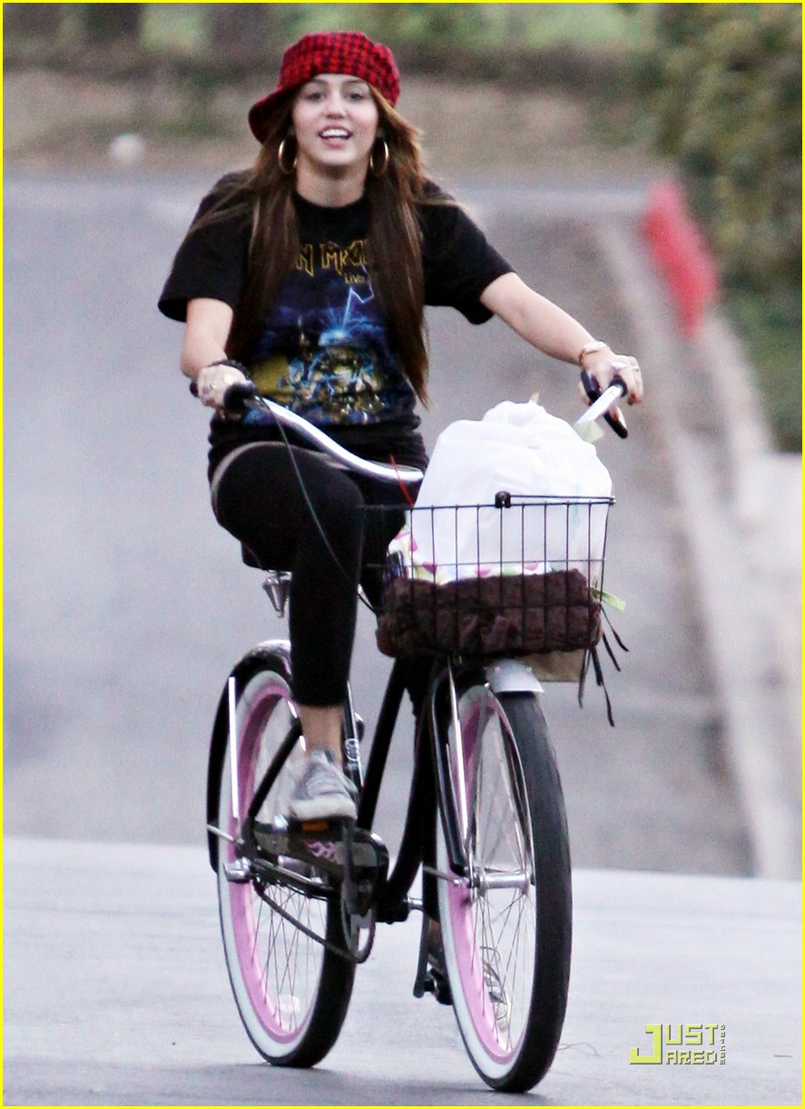 Miley Cyrus is a Bike Riding Beauty