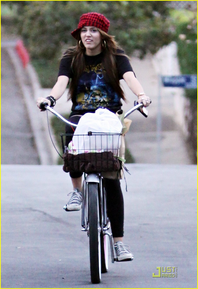 Miley Cyrus is a Bike Riding Beauty