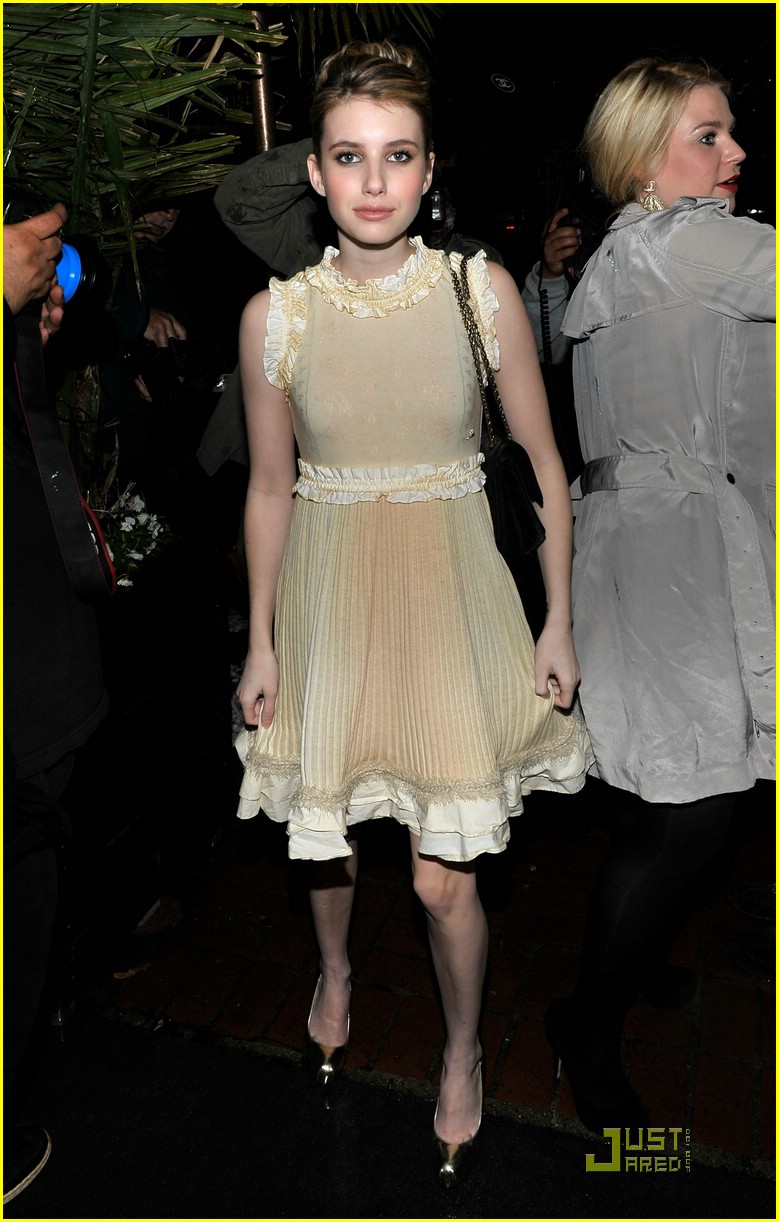 Emma Roberts wearing a beige CHANEL fringe dress