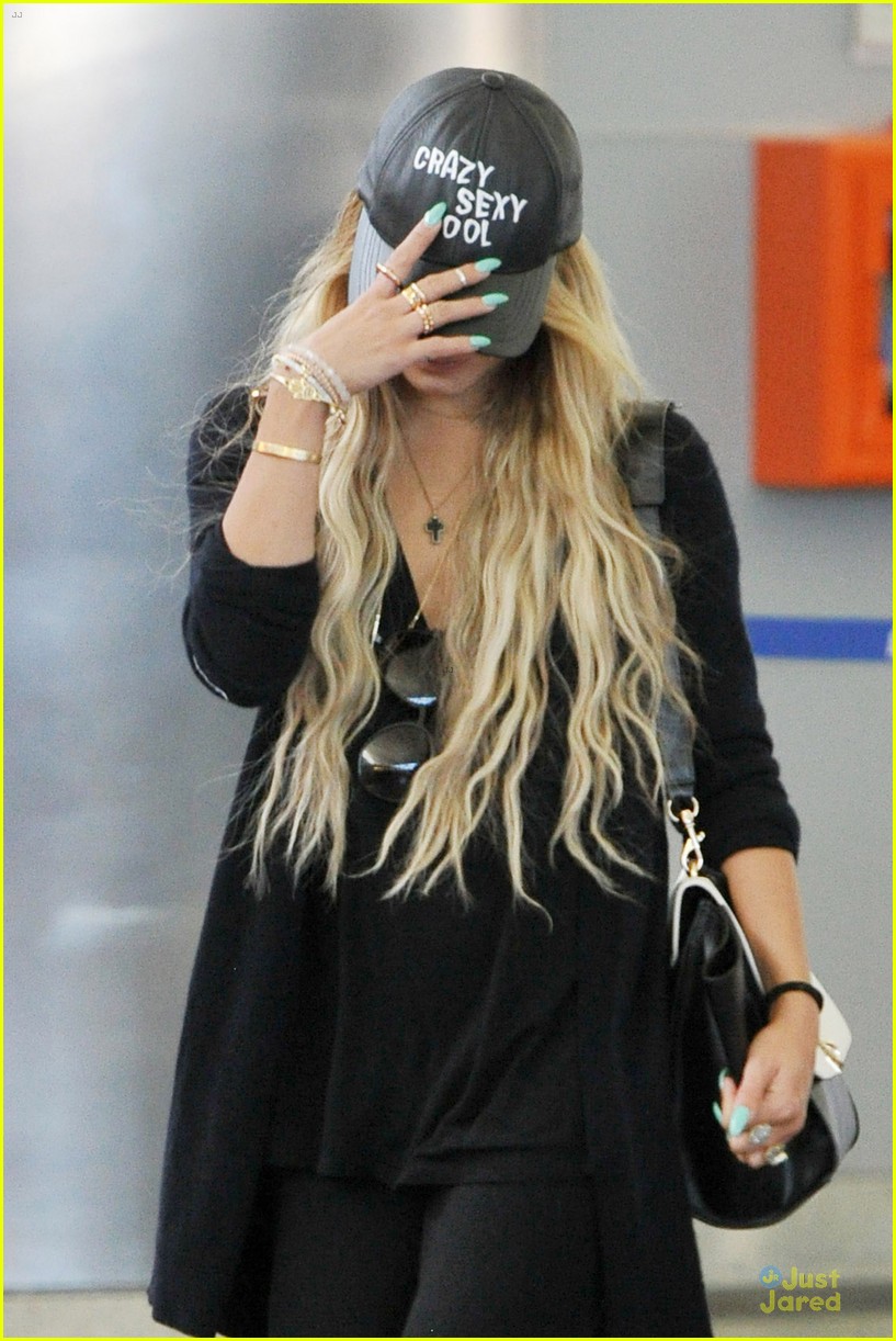 Vanessa Hudgens Keeps It Red at LAX Airport!