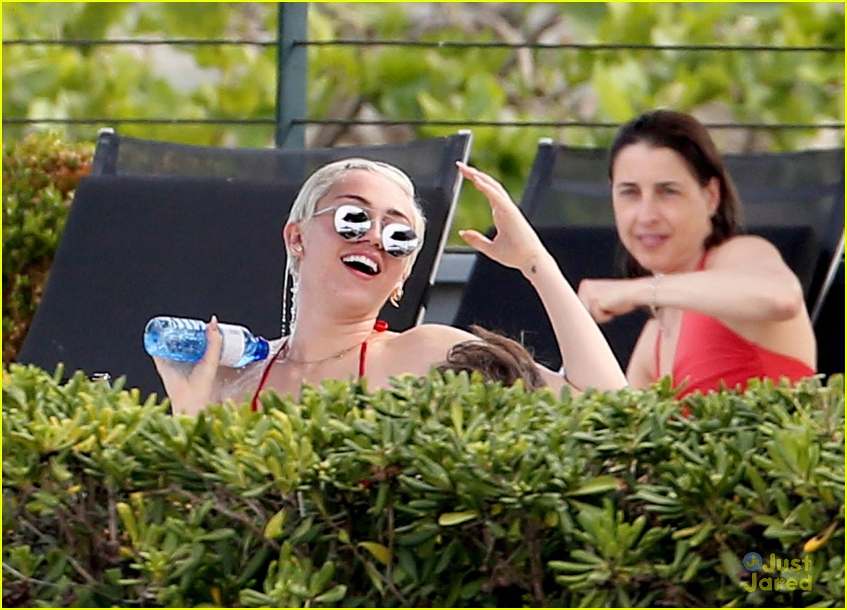 Miley Cyrus Flaunts Her Bikini Body Poolside in Barcelona!