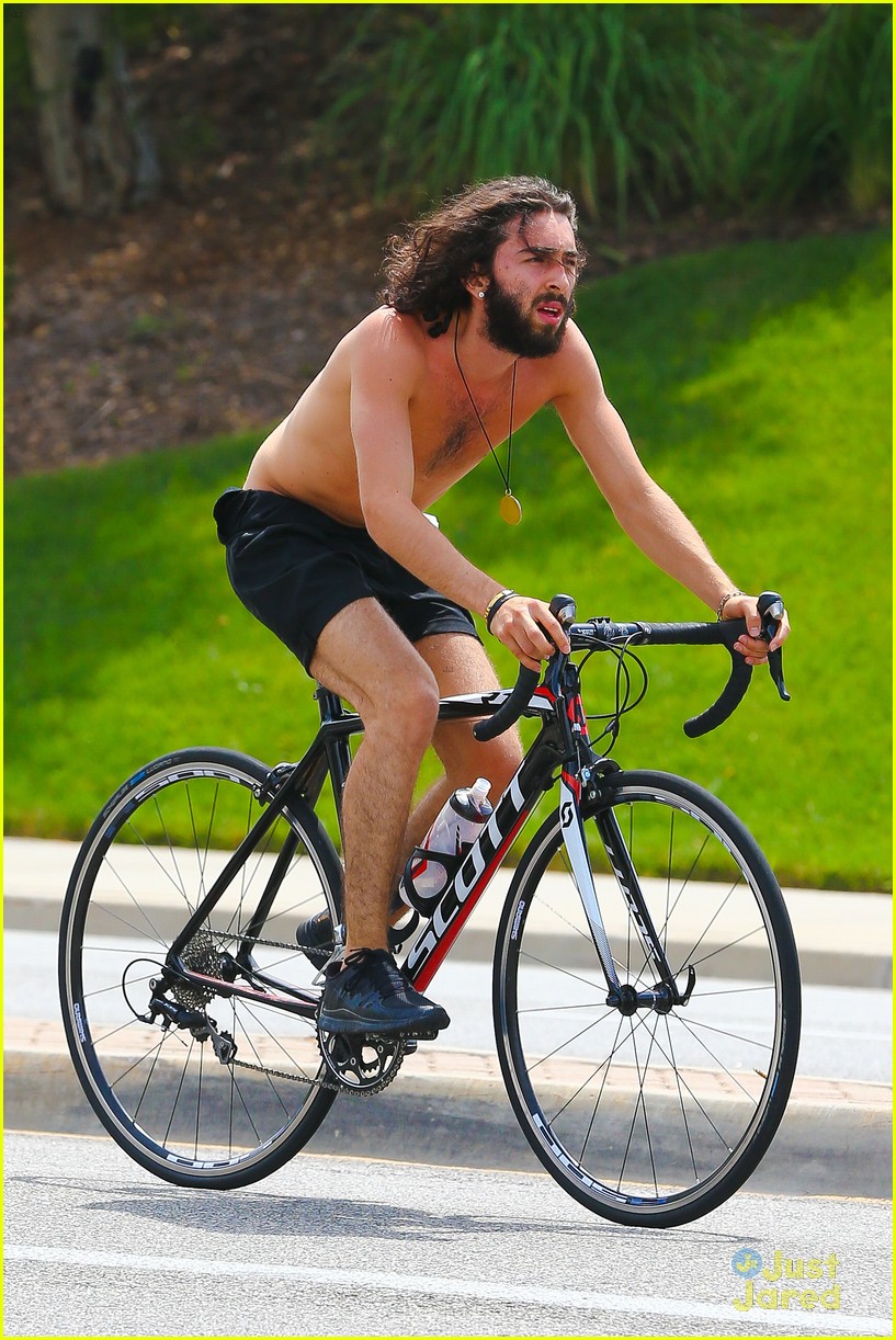 Mateo Arias Takes a Shirtless Bike Ride with a Full Beard & Long Hair