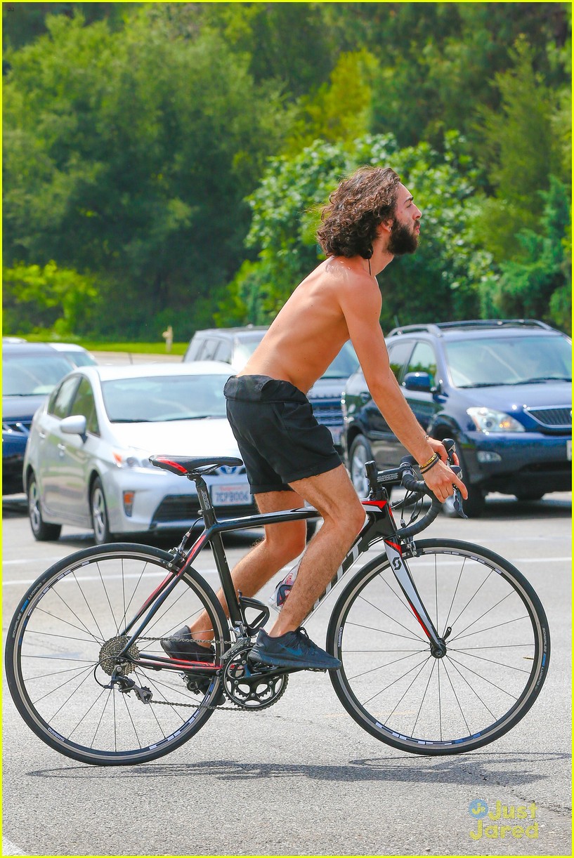 Mateo Arias Takes a Shirtless Bike Ride with a Full Beard & Long Hair