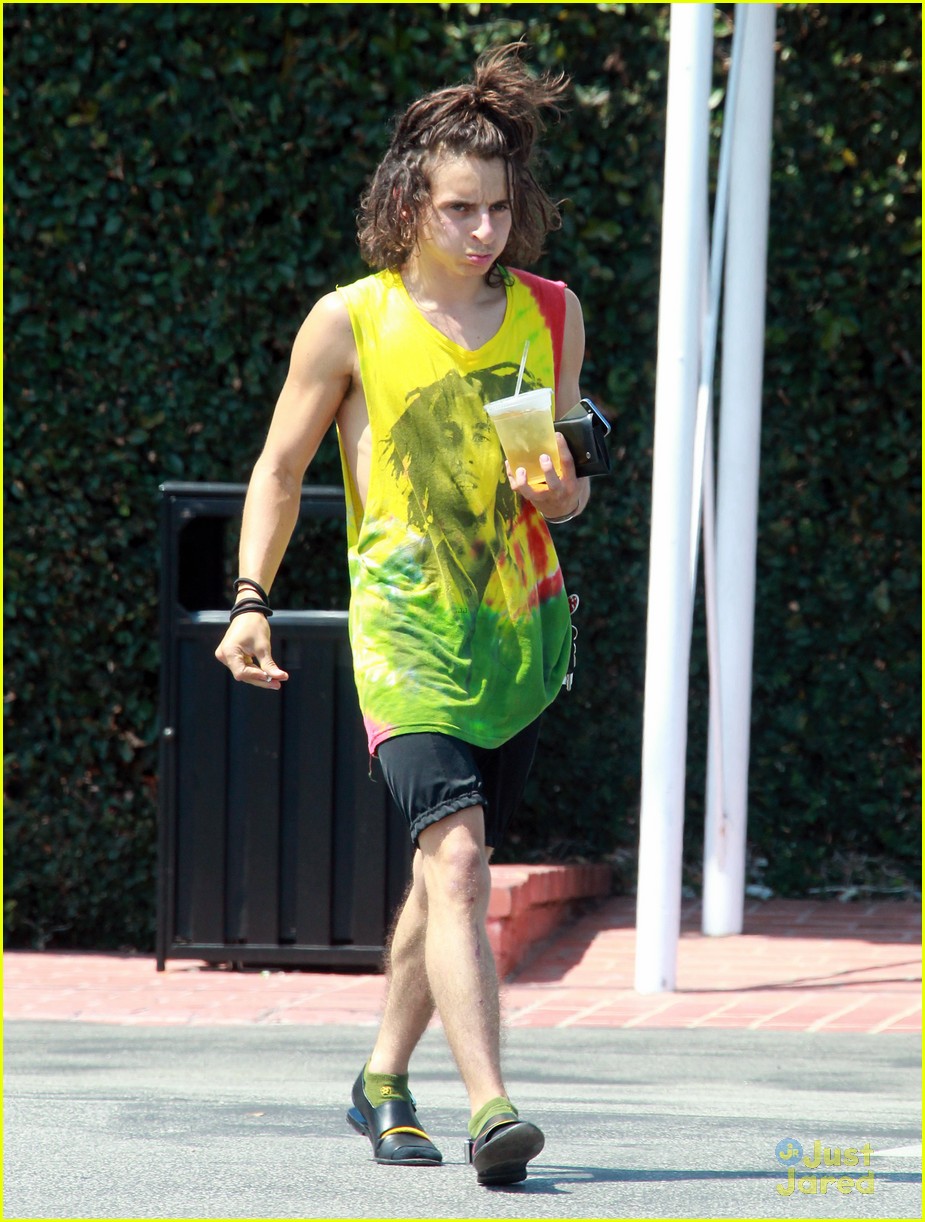 Moises Arias Rocks a Messy Bun & Colorful Bob Marley Shirt