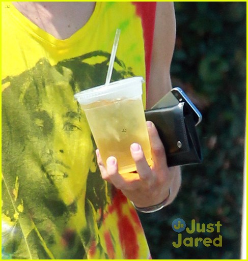 Moises Arias Rocks a Messy Bun & Colorful Bob Marley Shirt