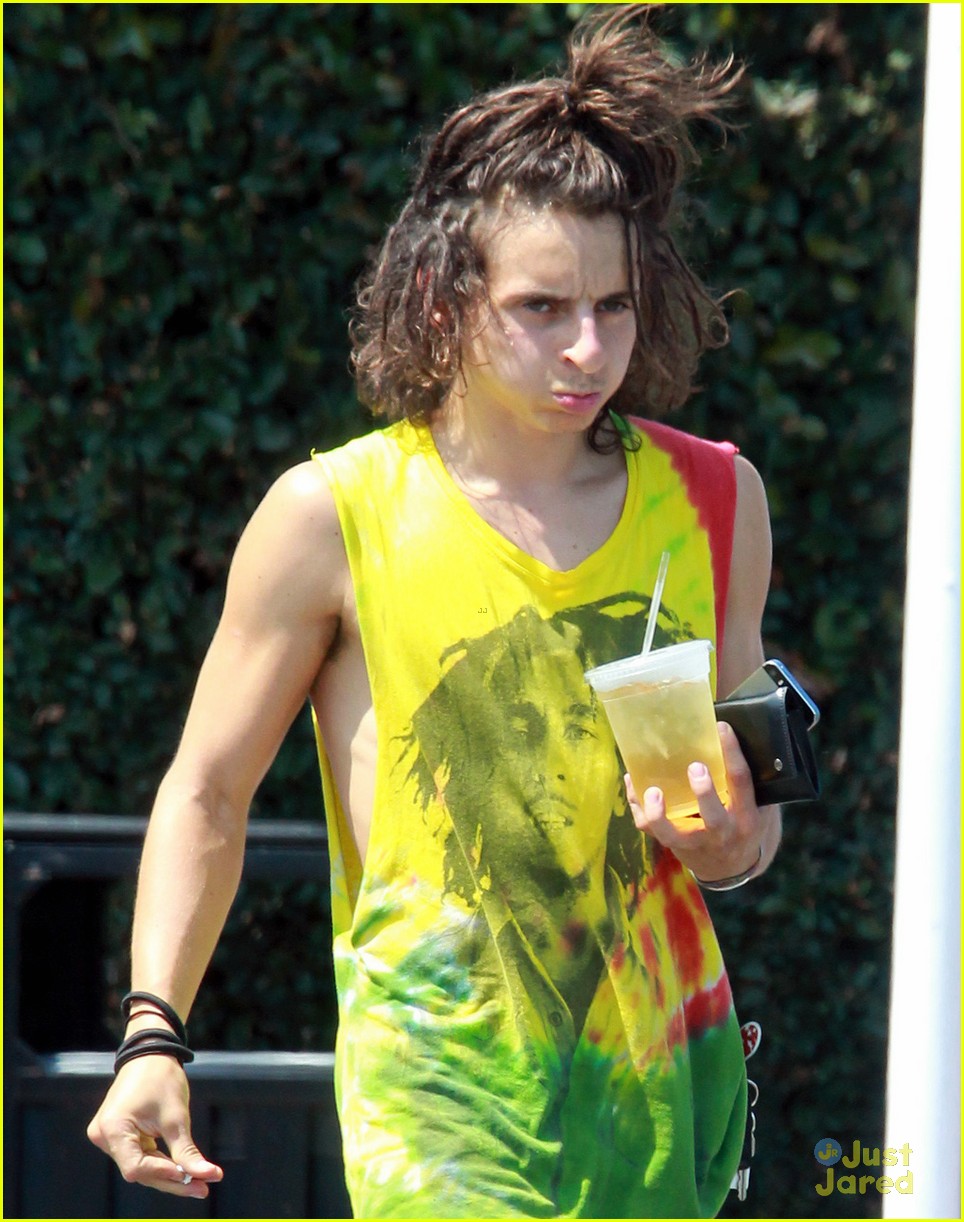 Moises Arias Rocks a Messy Bun & Colorful Bob Marley Shirt