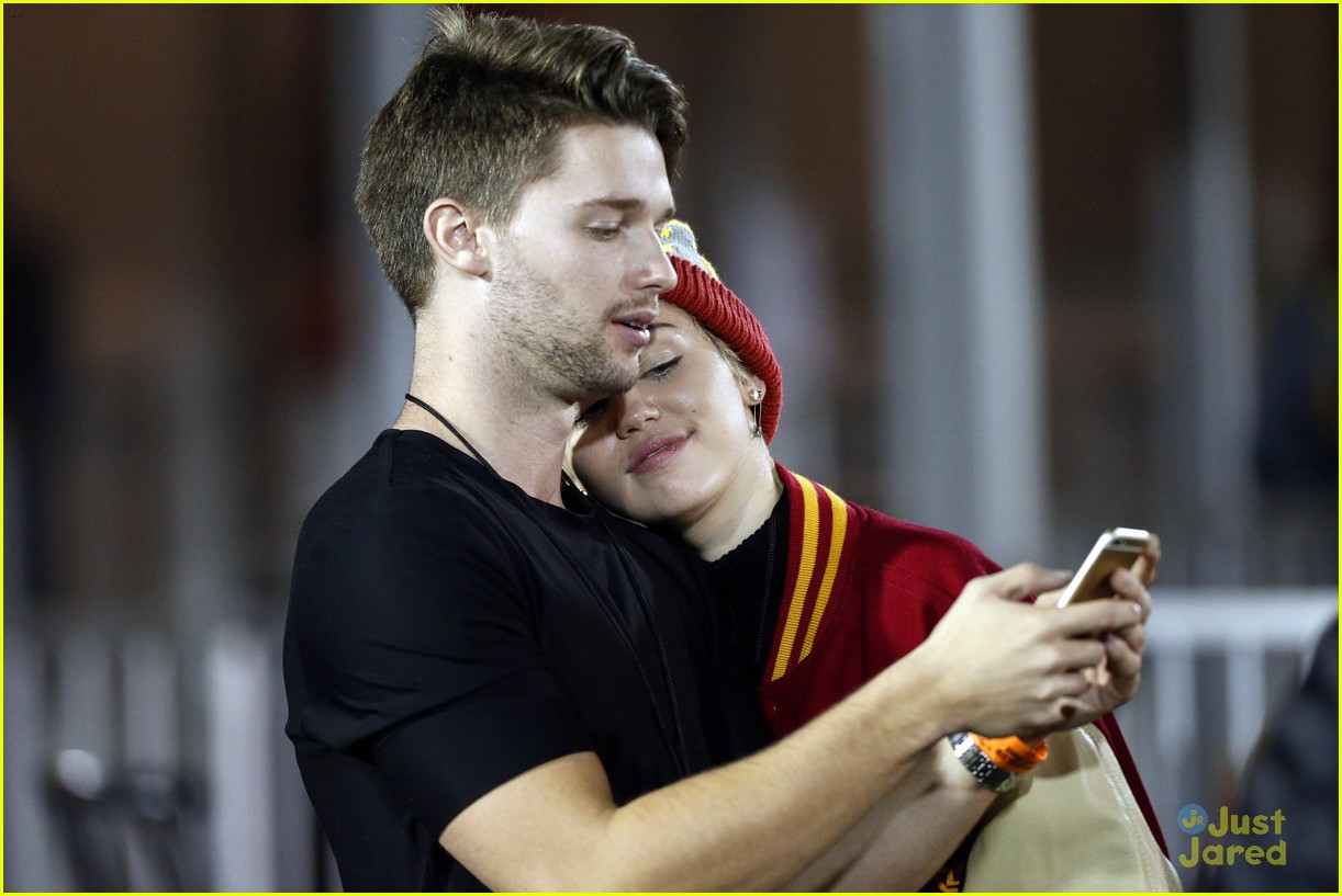 Miley Cyrus Makes Out with Patrick Schwarzenegger at USC Football Game (Photos)