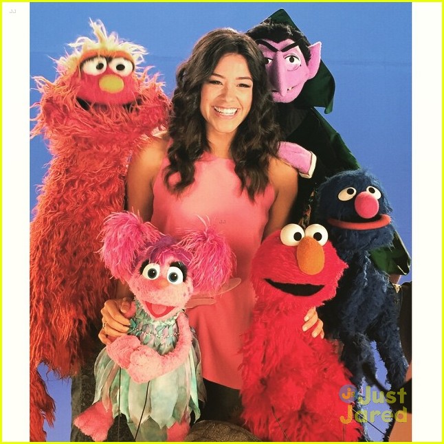 Gina Rodriguez Steals Kisses From Sesame Street's Elmo!