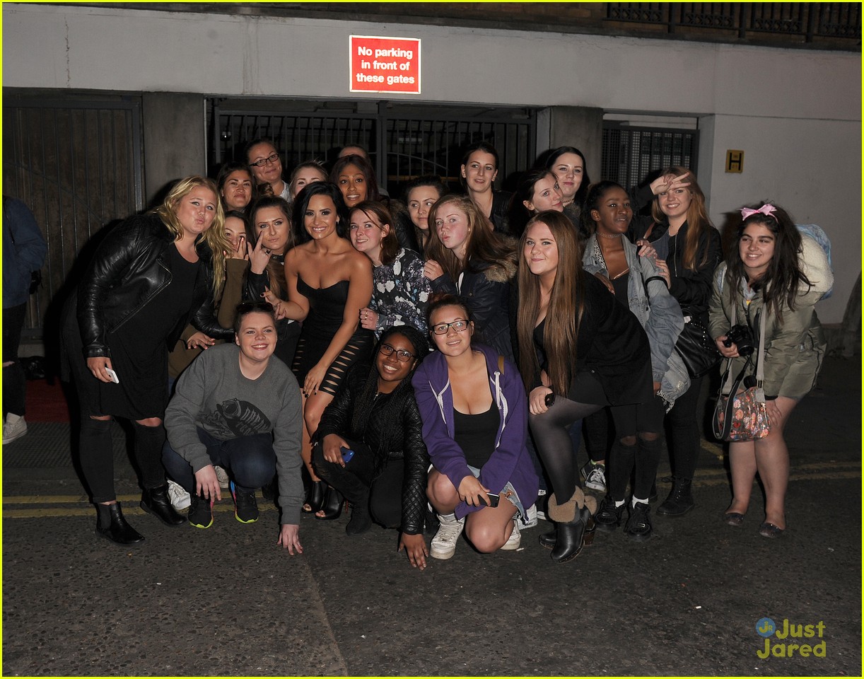 Demi Lovato Takes Group Fan Shots In Hot Leather Dress in London