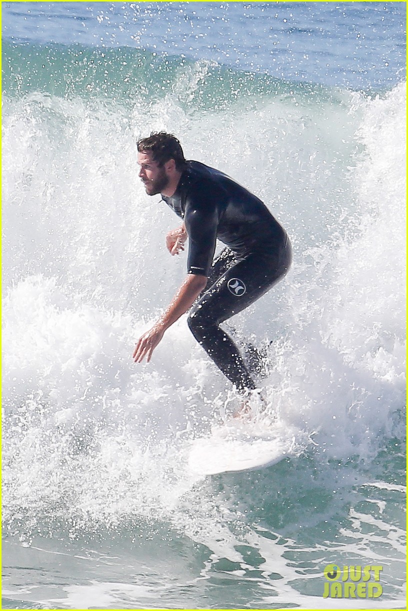 Liam Hemsworth Rocks a Wetsuit While Surfing