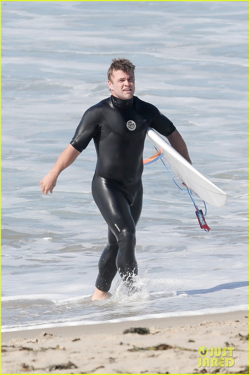 Liam Hemsworth Rocks a Wetsuit While Surfing