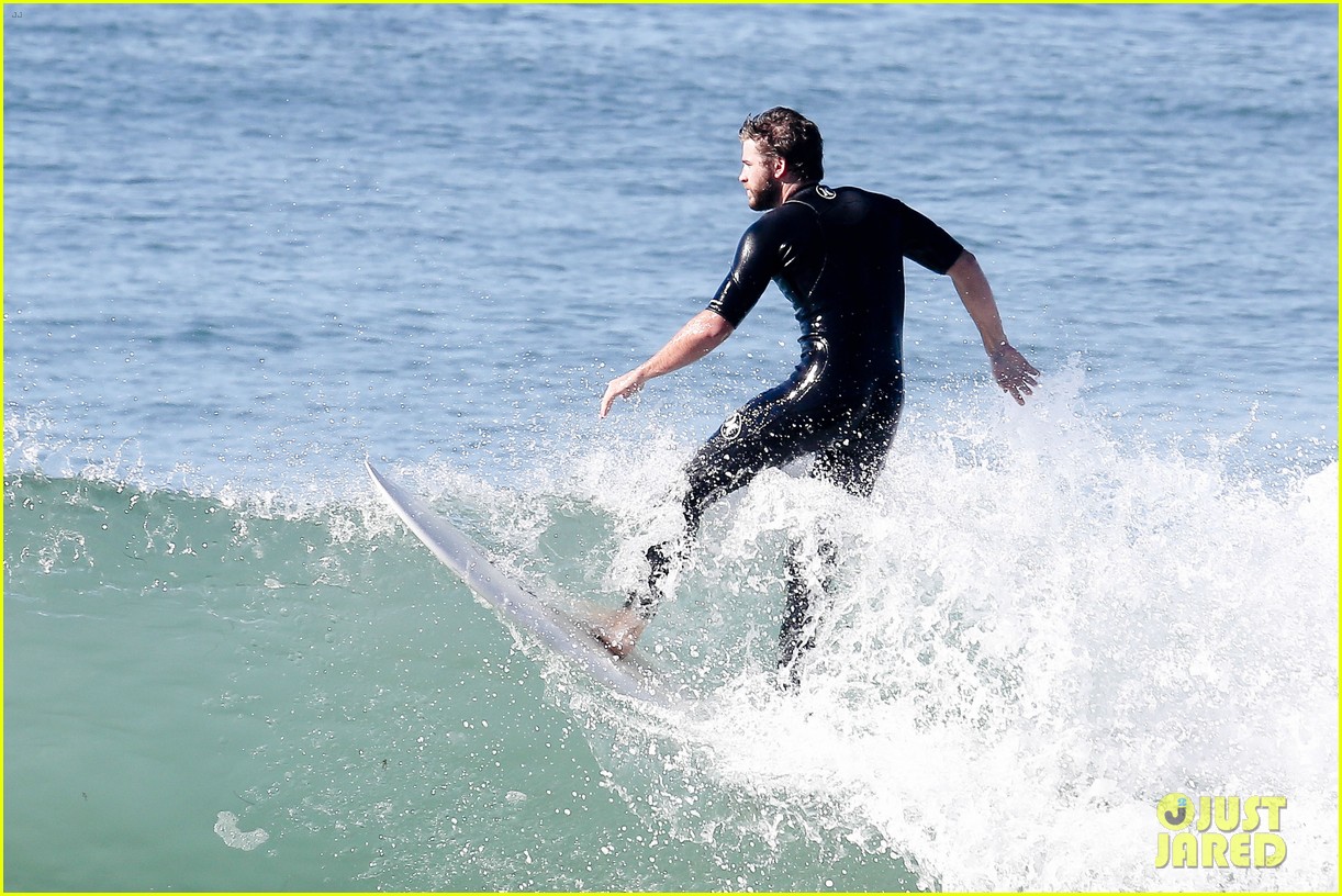 Liam Hemsworth Rocks a Wetsuit While Surfing