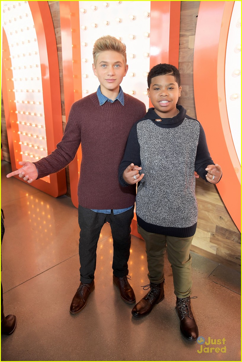 Jack Griffo Sports Scruffy Beard & Sharp Suit For Nickelodeon's New Complex Grand Opening