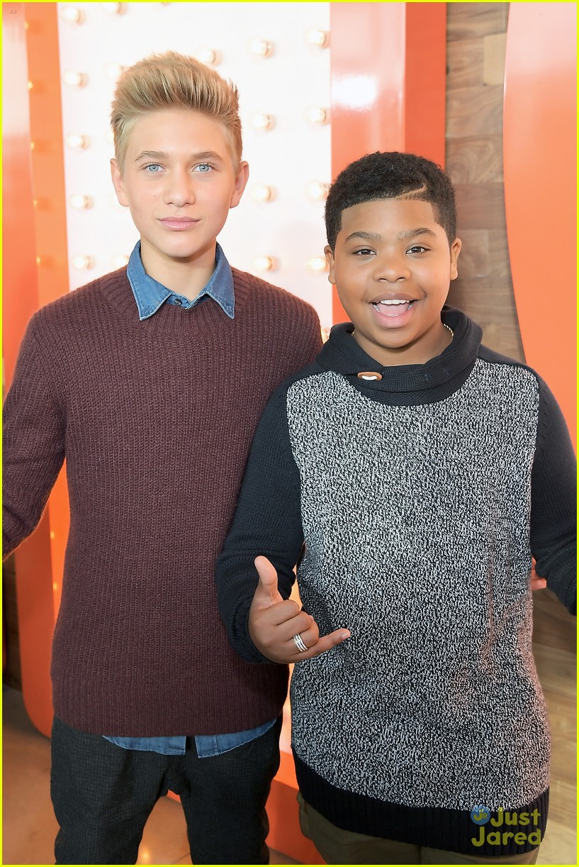 Jack Griffo Sports Scruffy Beard & Sharp Suit For Nickelodeon's New Complex Grand Opening