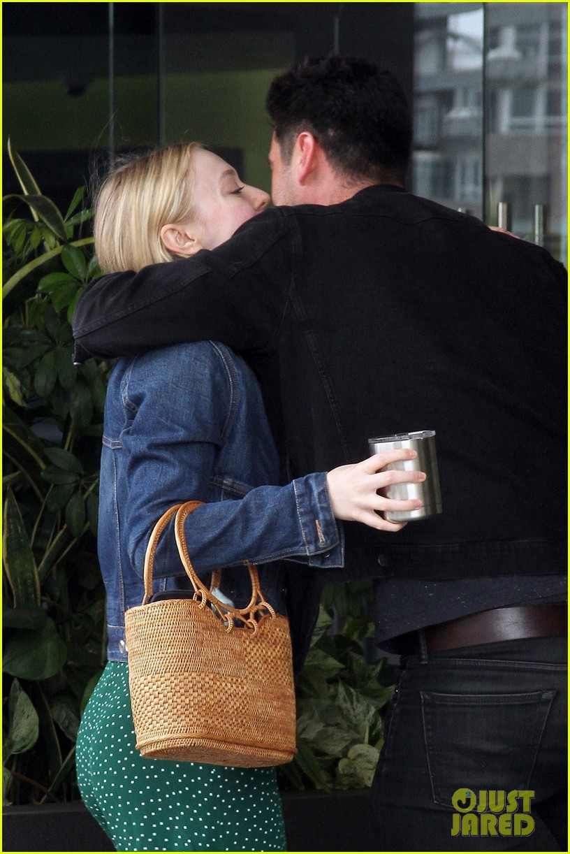 Dakota Fanning Dons Denim Jacket With Green Polka-Dot Dress for Work Meeting