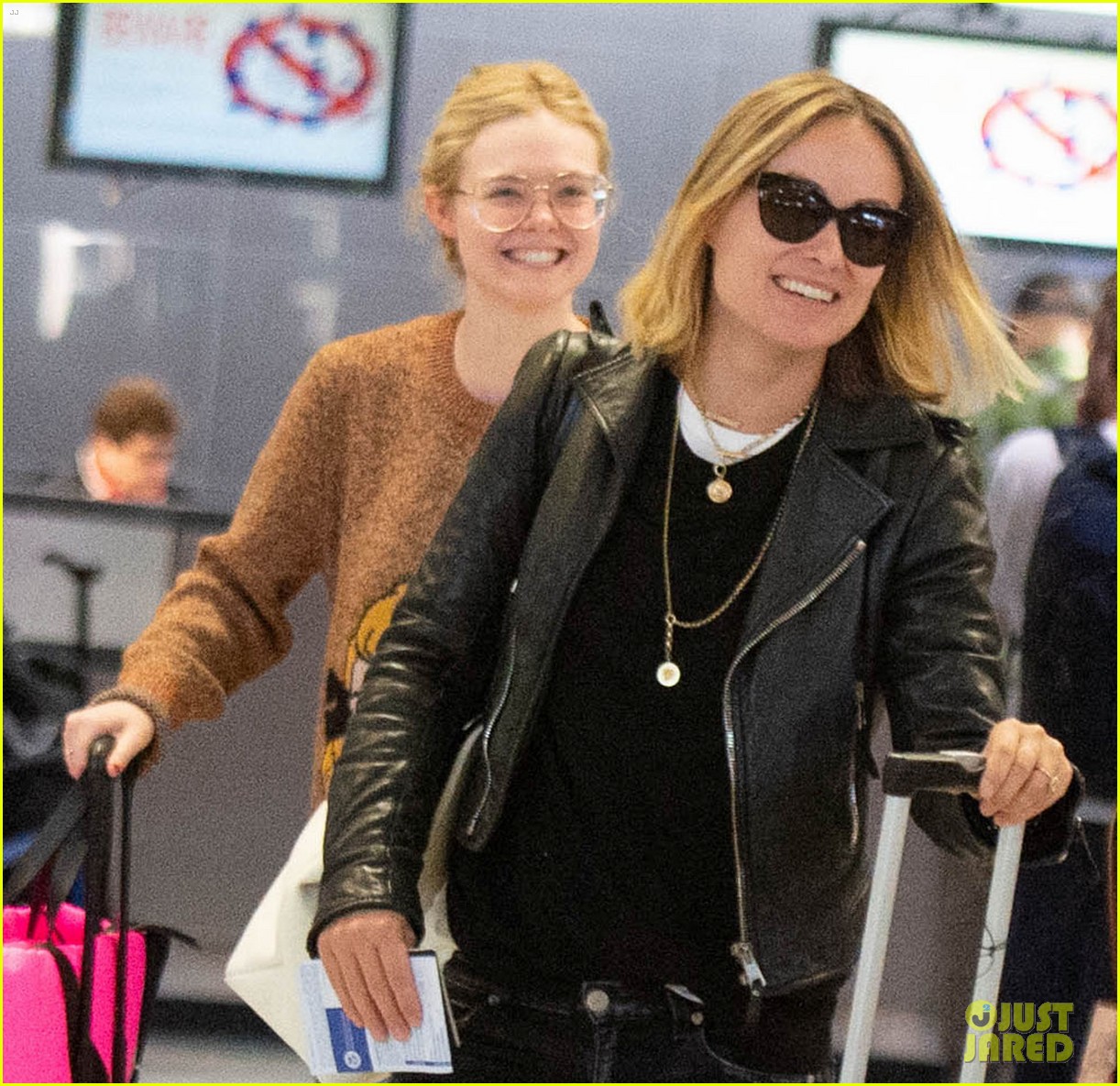 Elle Fanning Flashes a Grin While Landing in NYC After Paris Fashion Week