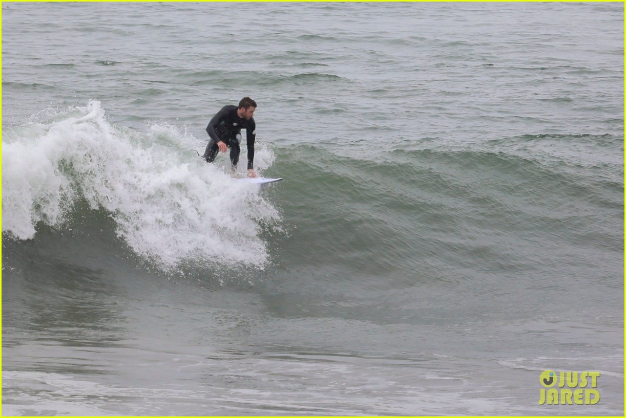 Liam Hemsworth Goes Surfing After Arriving Back in L.A.