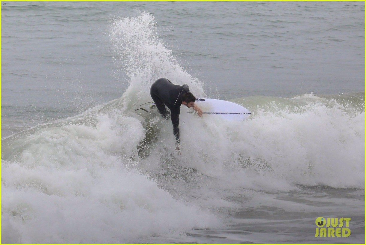 Liam Hemsworth Goes Surfing After Arriving Back in L.A.
