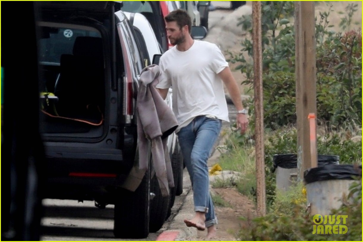 Liam Hemsworth Goes Surfing After Arriving Back in L.A.