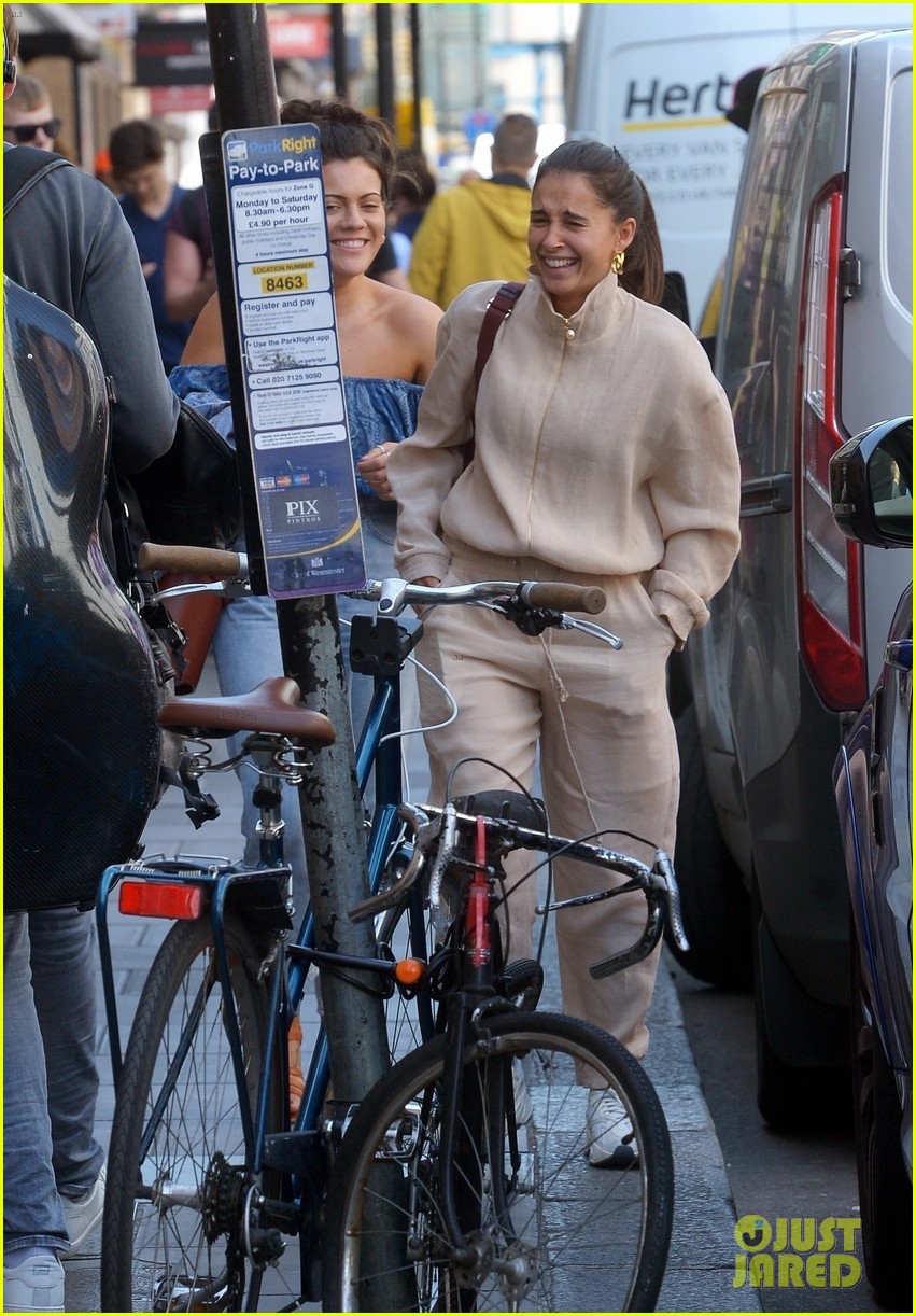 Naomi Scott Shares a Laugh with a Friend in London!