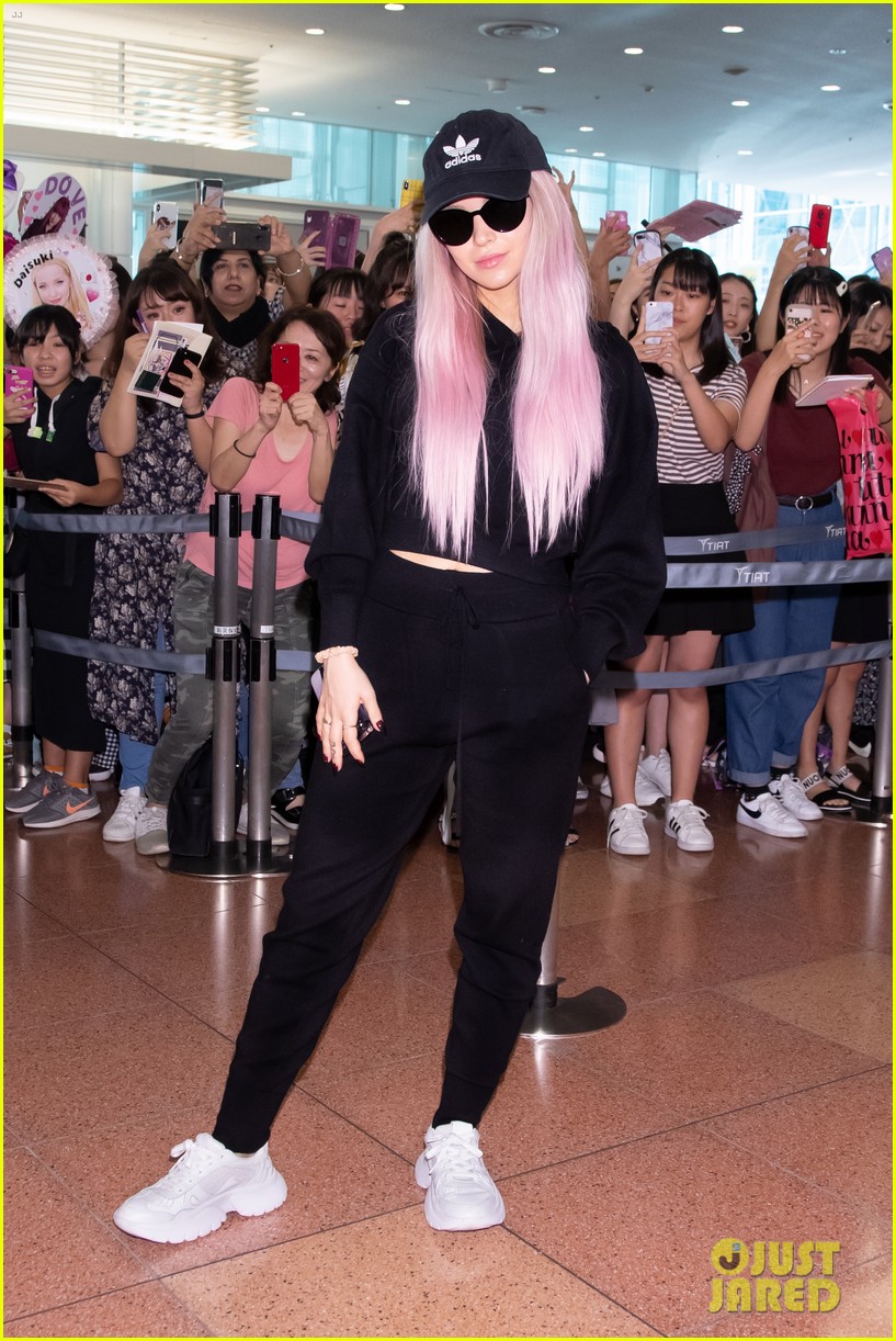 Dove Cameron Rocks Pink Hair While Arriving in Japan