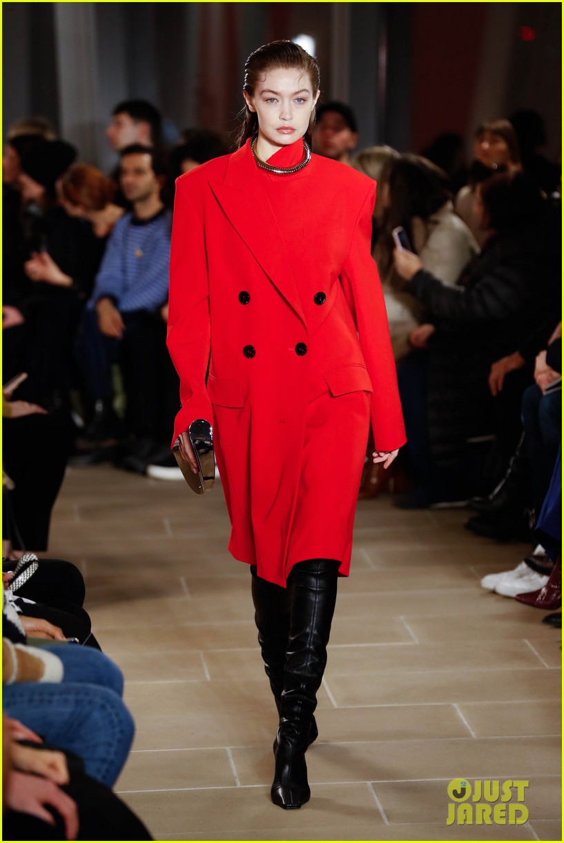 Gigi Hadid Wears Red Hot Coat For Proenza Schouler's Fashion Show