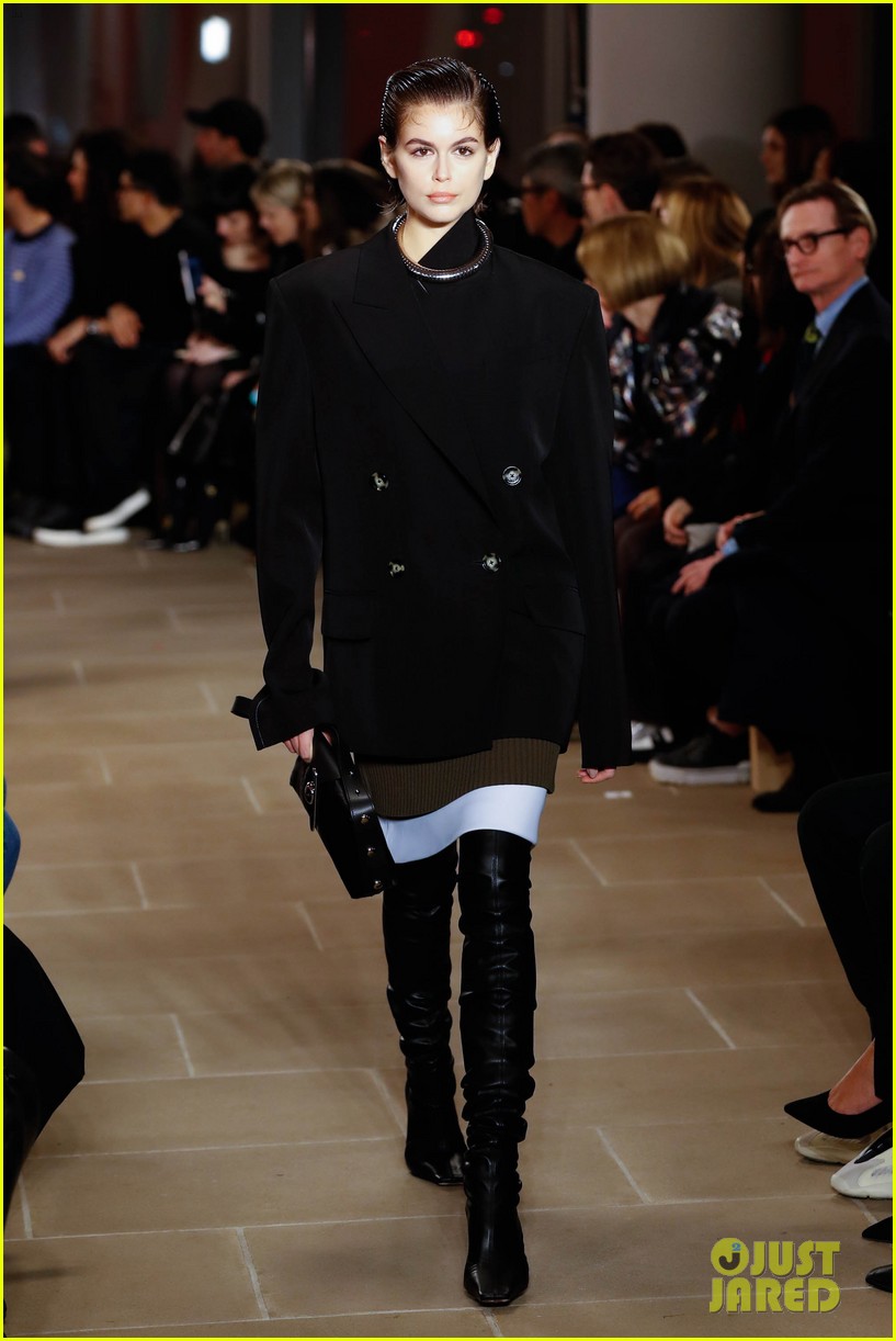 Gigi Hadid Wears Red Hot Coat For Proenza Schouler's Fashion Show