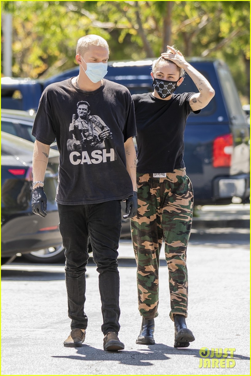 Miley Cyrus Wears a Gucci Face Mask for an Outing with Cody Simpson