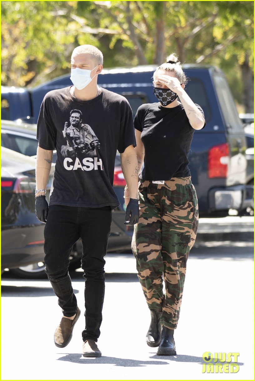 Miley Cyrus Wears a Gucci Face Mask for an Outing with Cody Simpson