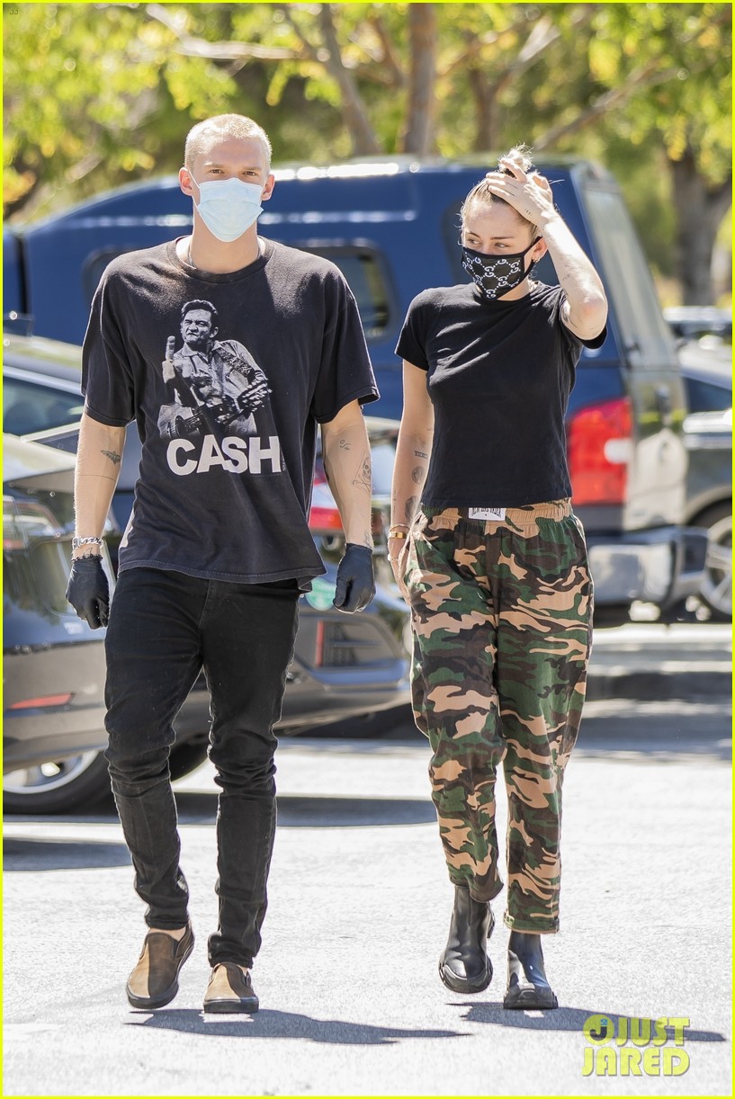 Miley Cyrus Wears a Gucci Face Mask for an Outing with Cody Simpson