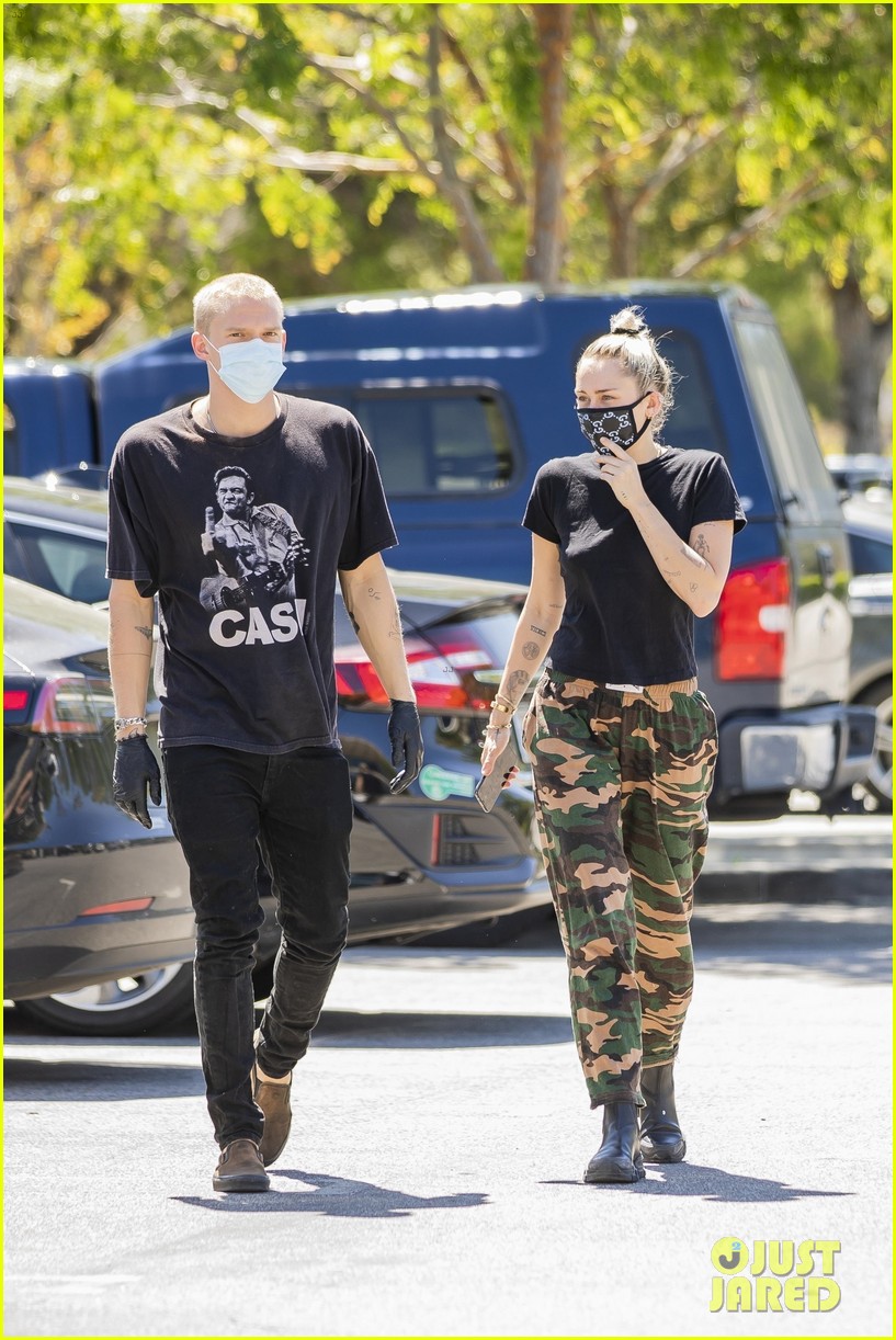 Miley Cyrus Wears a Gucci Face Mask for an Outing with Cody Simpson