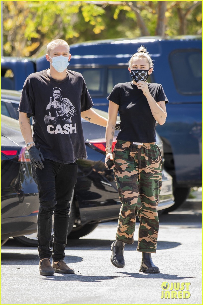 Miley Cyrus Wears a Gucci Face Mask for an Outing with Cody Simpson