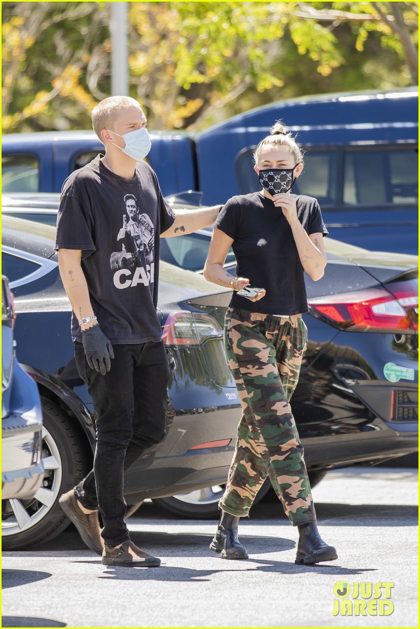 Miley Cyrus Wears a Gucci Face Mask for an Outing with Cody Simpson