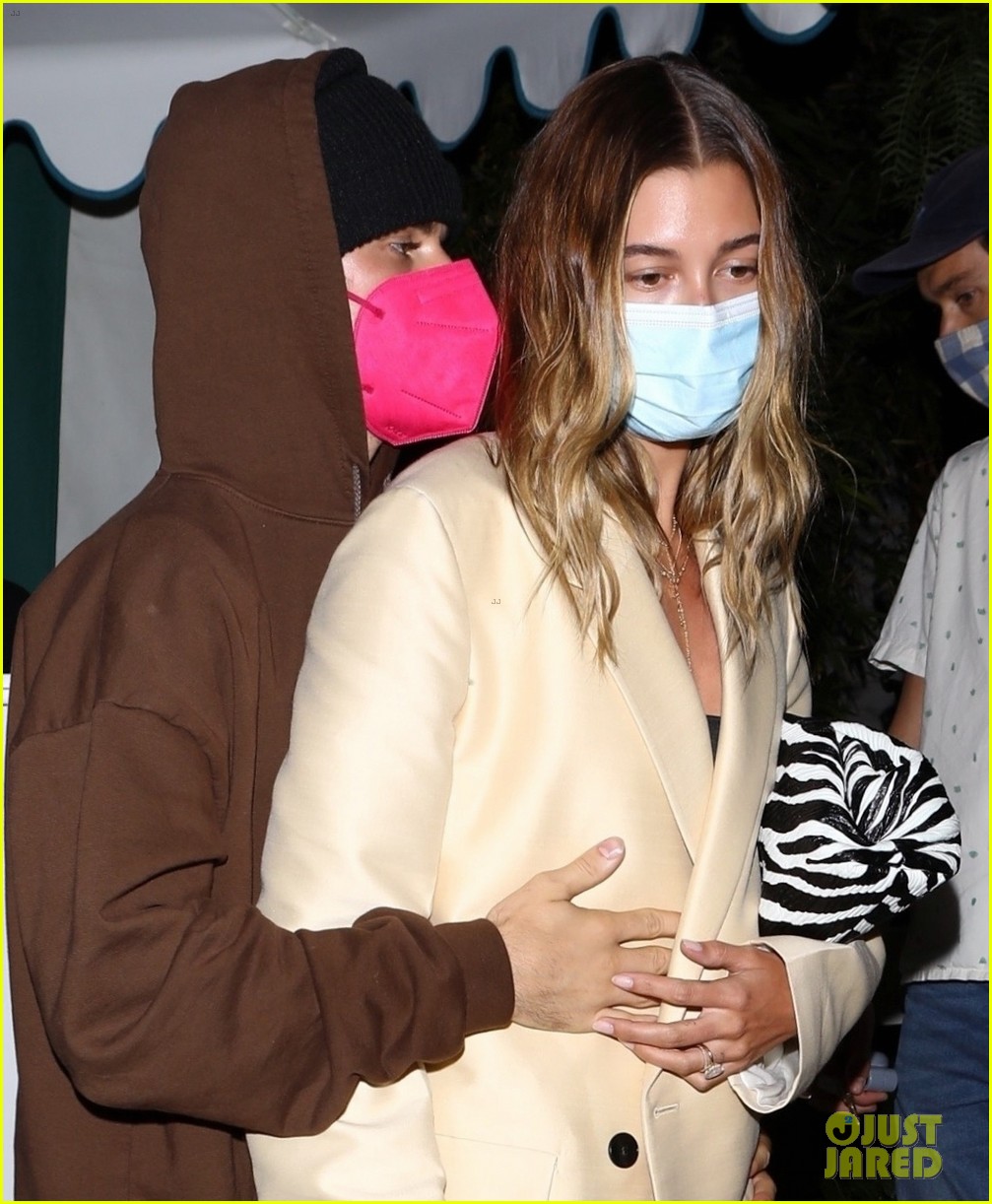 Justin Bieber Holds on Close to Wife Hailey While Leaving a Restaurant