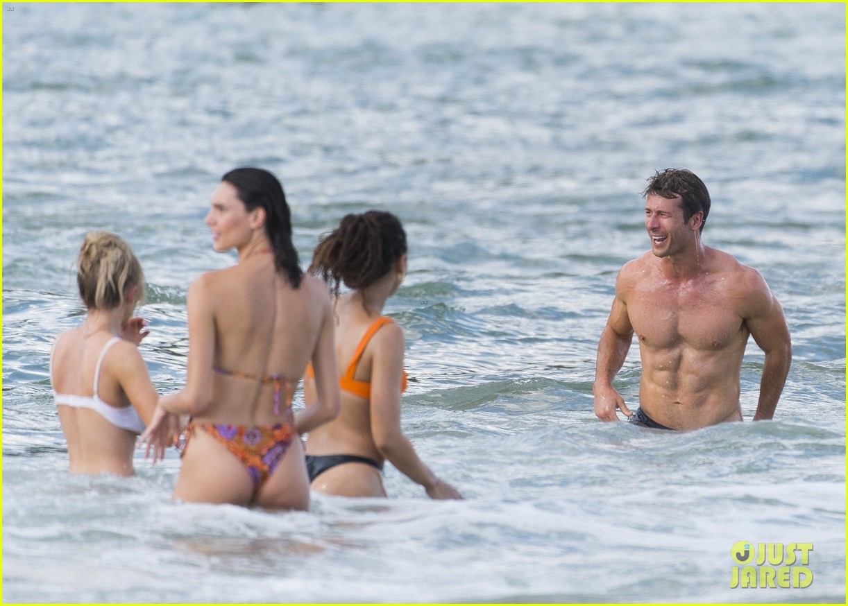 Sydney Sweeney Hits the Beach in White Bikini for Rom-Com Beach Scene with Glen Powell (Photos)