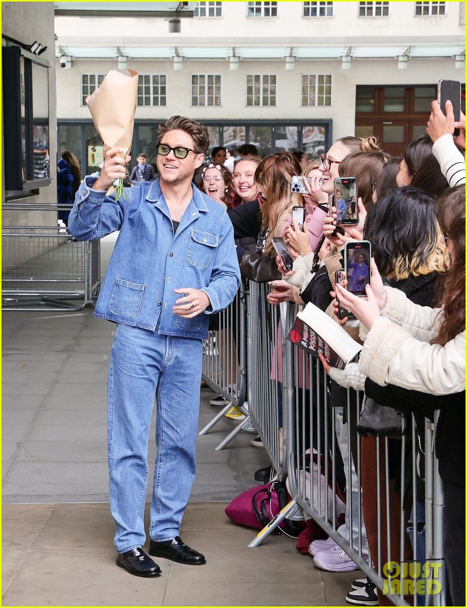 Niall Horan Rocks Double Denim & Accepts Flowers From a Fan Ahead of the Release of His New Single 'Meltdown'
