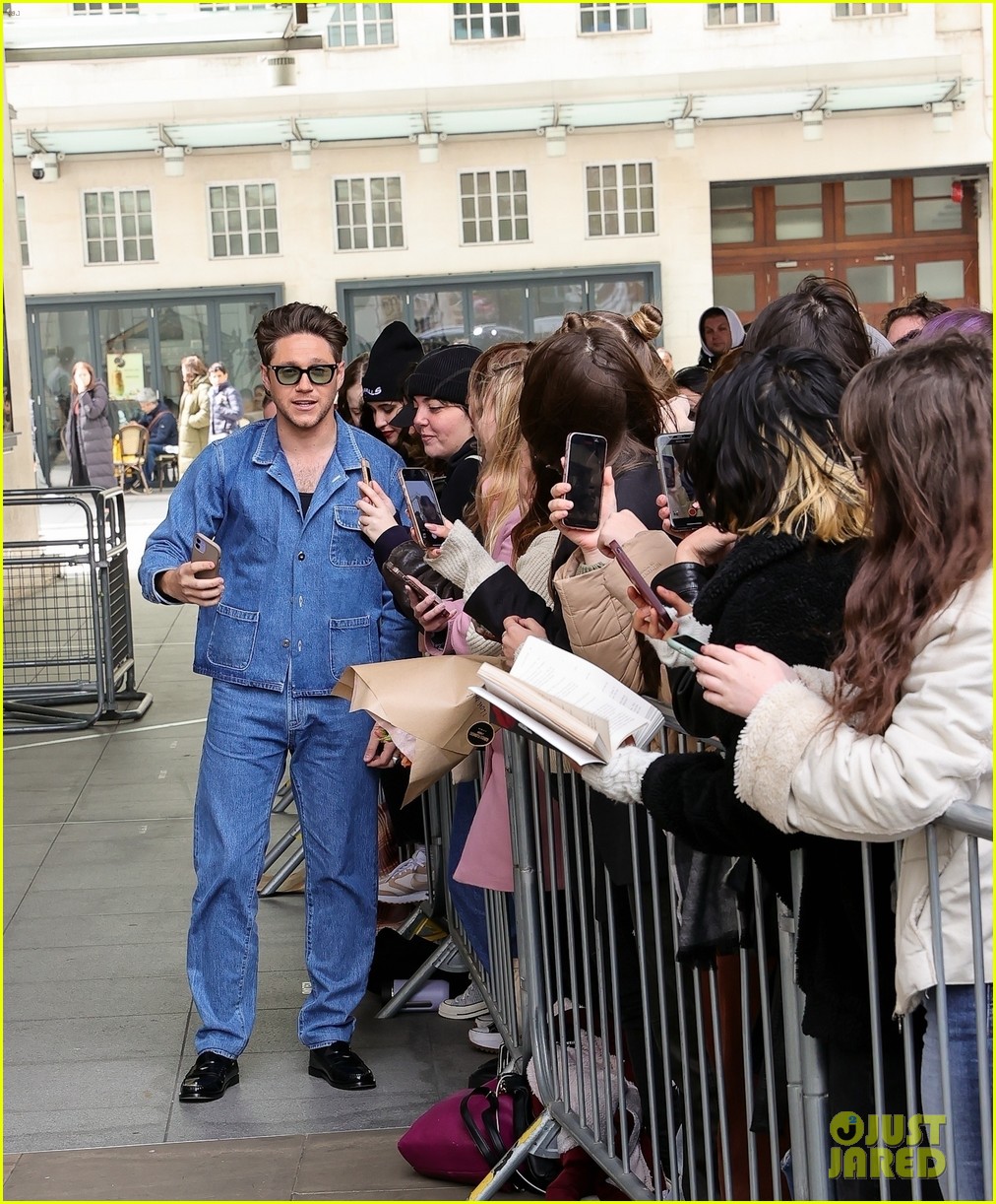 Niall Horan Rocks Double Denim & Accepts Flowers From a Fan Ahead of the Release of His New Single 'Meltdown'