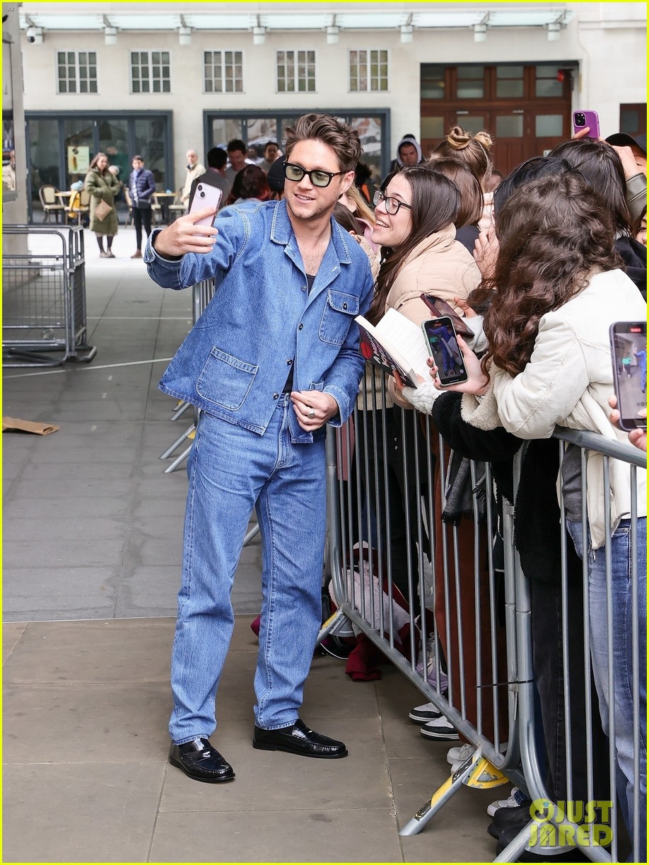 Niall Horan Rocks Double Denim & Accepts Flowers From a Fan Ahead of the Release of His New Single 'Meltdown'