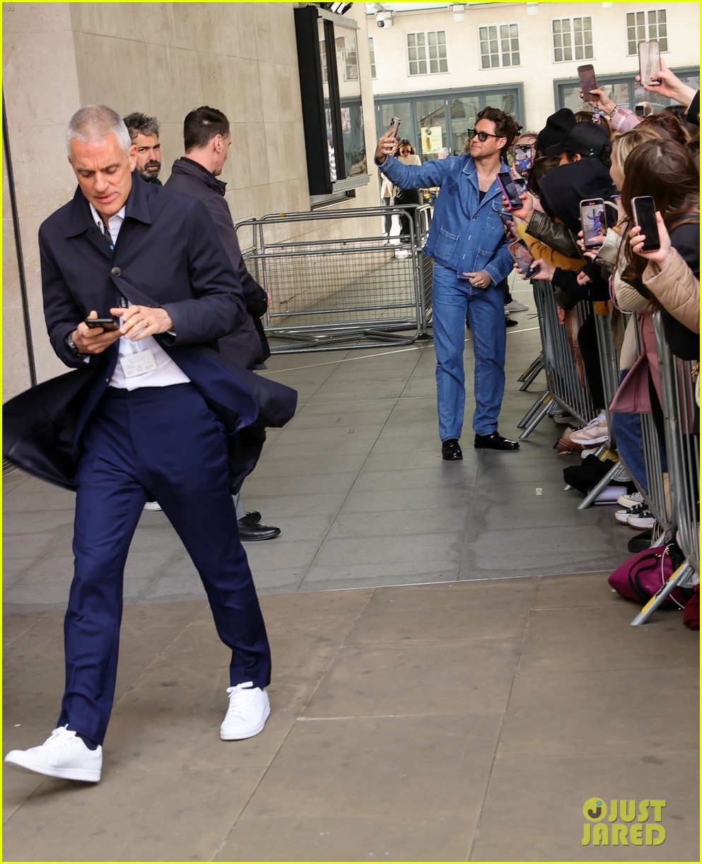Niall Horan Rocks Double Denim & Accepts Flowers From a Fan Ahead of the Release of His New Single 'Meltdown'