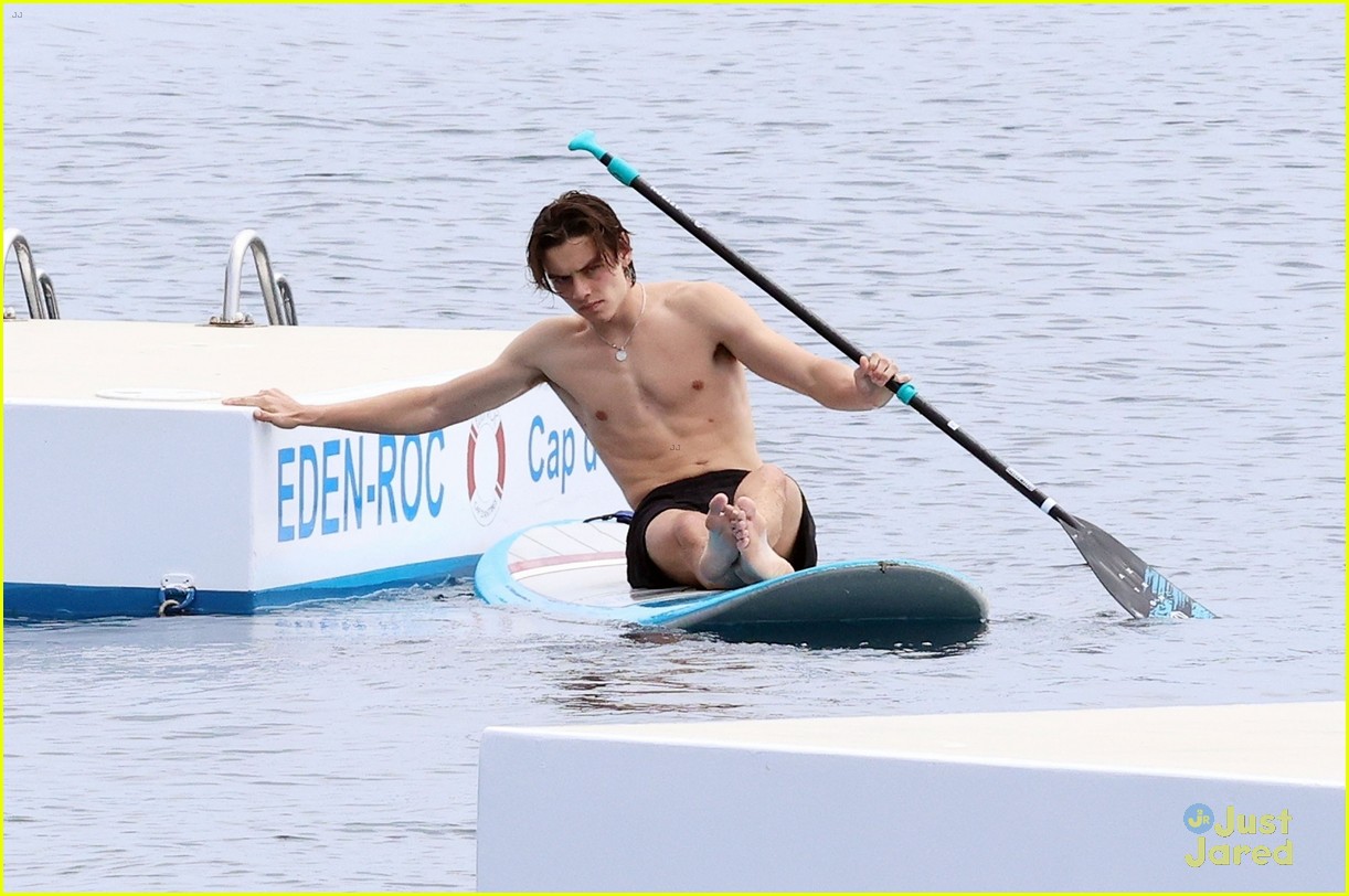 Louis Partridge Shows Off Shirtless Body While Paddleboarding in France During Cannes Film Festival