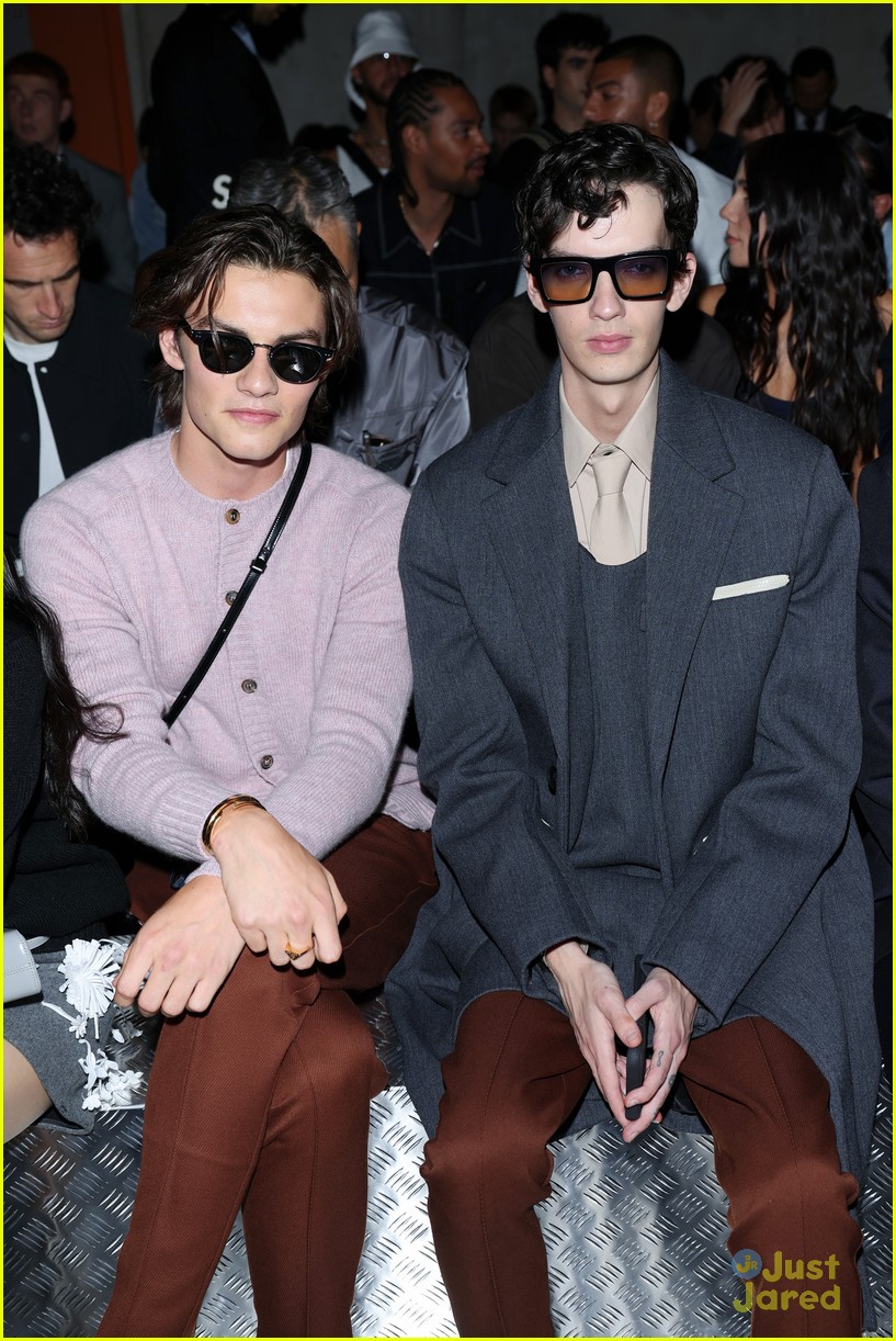 Taylor Zakhar Perez, Troye Sivan & Louis Partridge Sit Front Row at Prada Milan Fashion Show